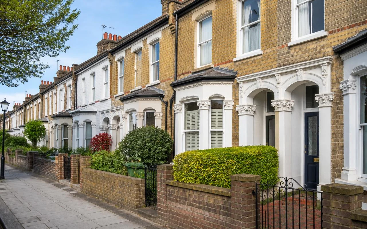 Victorian terraced houses with bay windows on a residential street in Lewisham
