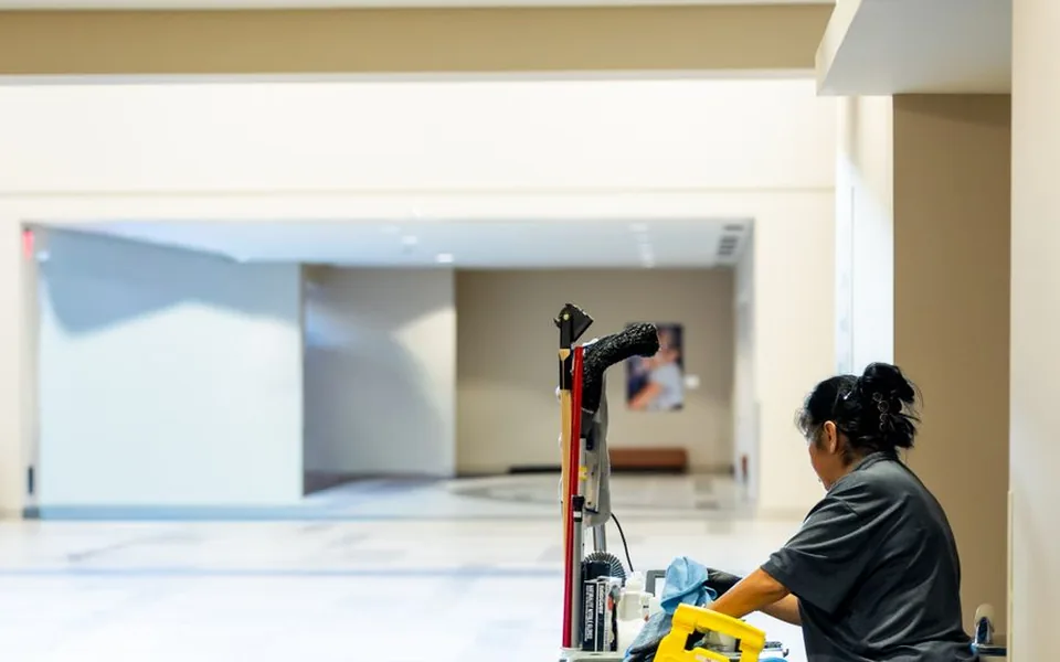 Communal corridor being cleaned with a professional cleaning trolley